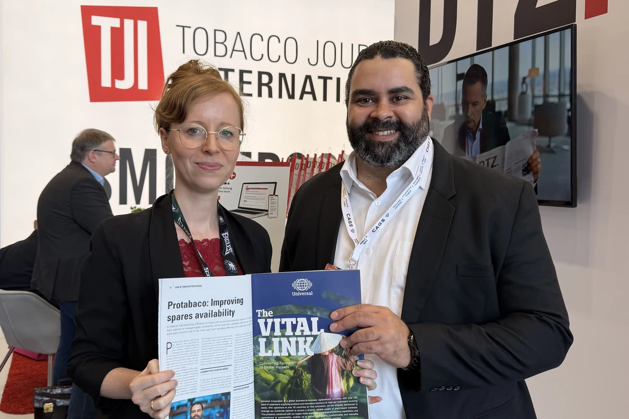 Marie Mayer of Tobacco Journal International and Ramon Emilio Peralta of Protabaco holding the printed issue at InterTabac 2026.